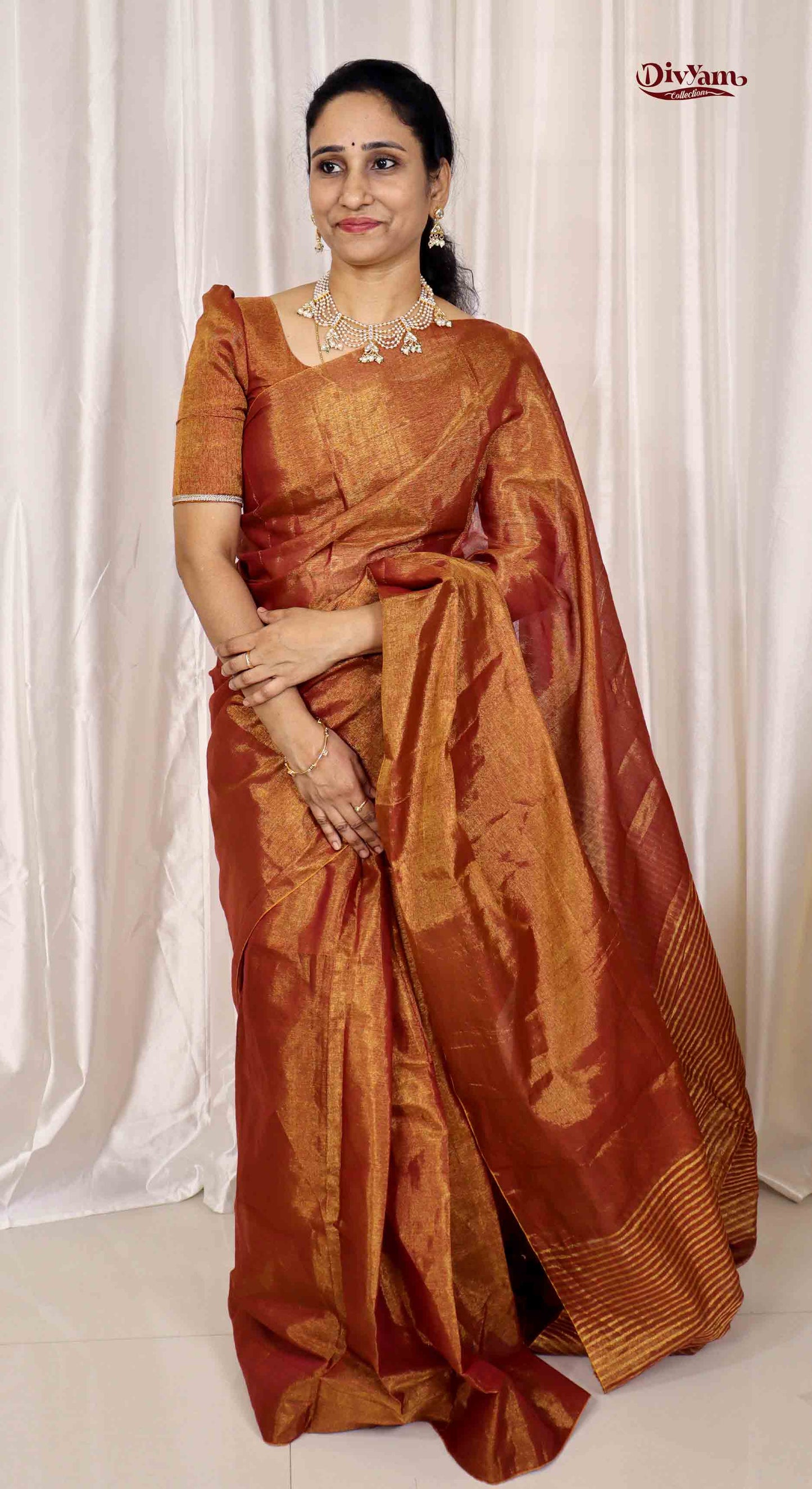 DC166 | Tissue Linen Saree with Golden Zari & Pom-Pom Tassels | Lightweight Festive Wear Saree