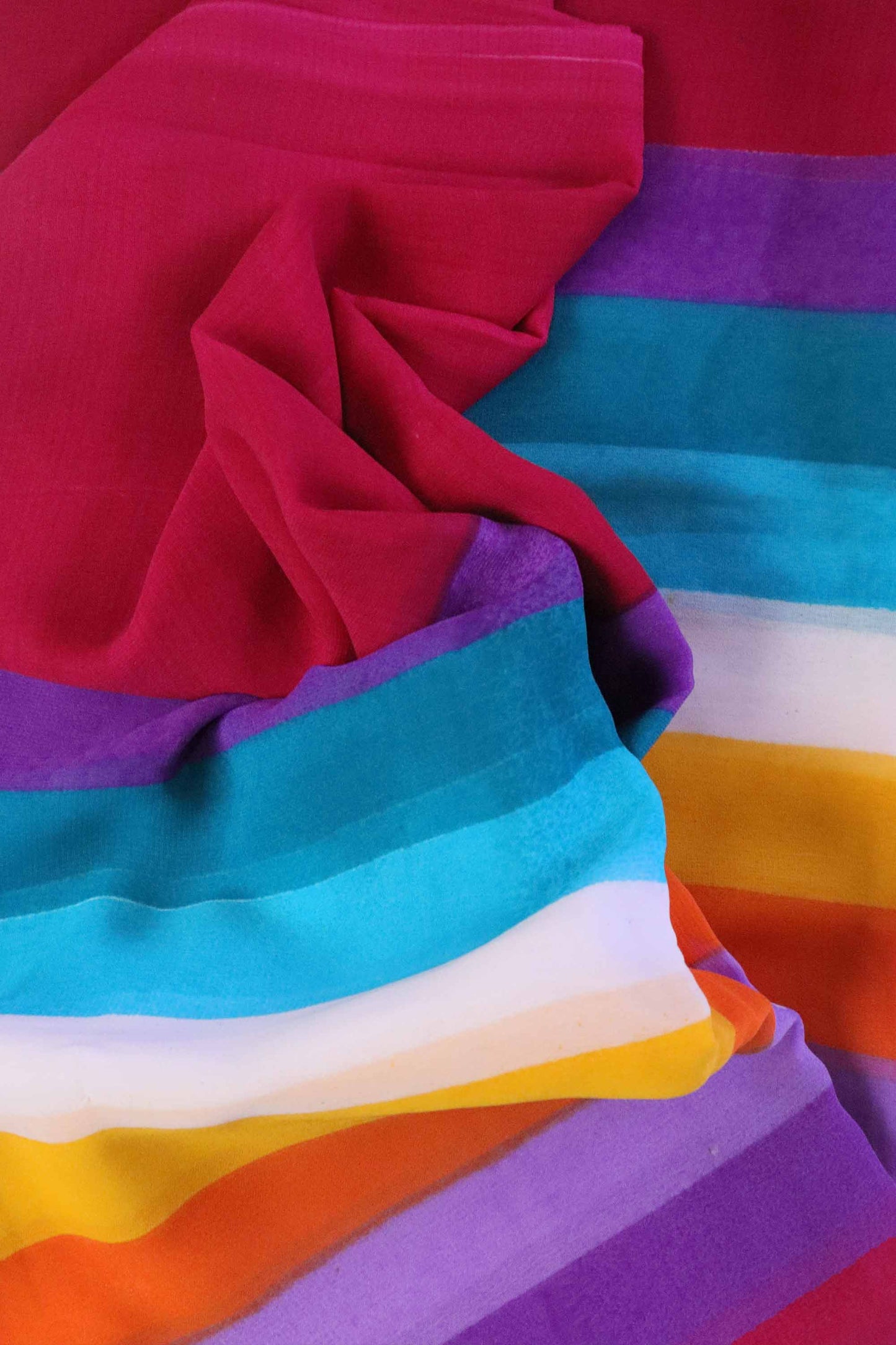 DCGE74 Rainbow Striped Georgette Saree with Floral Fancy Silk Design & Orange Hues