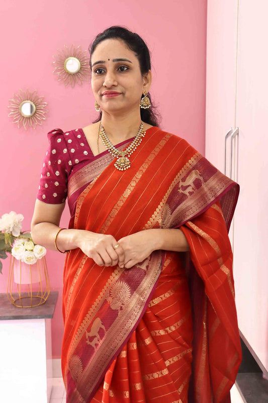 DC118 | Dark Orange Fancy Silk Saree with Gold Zari Lines & Animal Motif Border | Contrast Blouse